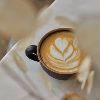 A delicious cup of barista-made coffee with latte art finish